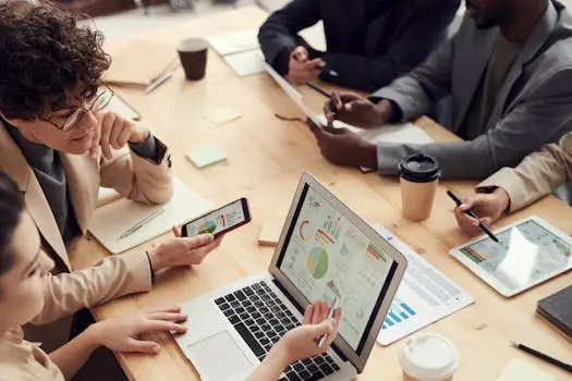 A multicultural team discussing analytics and strategy in a modern office setting.